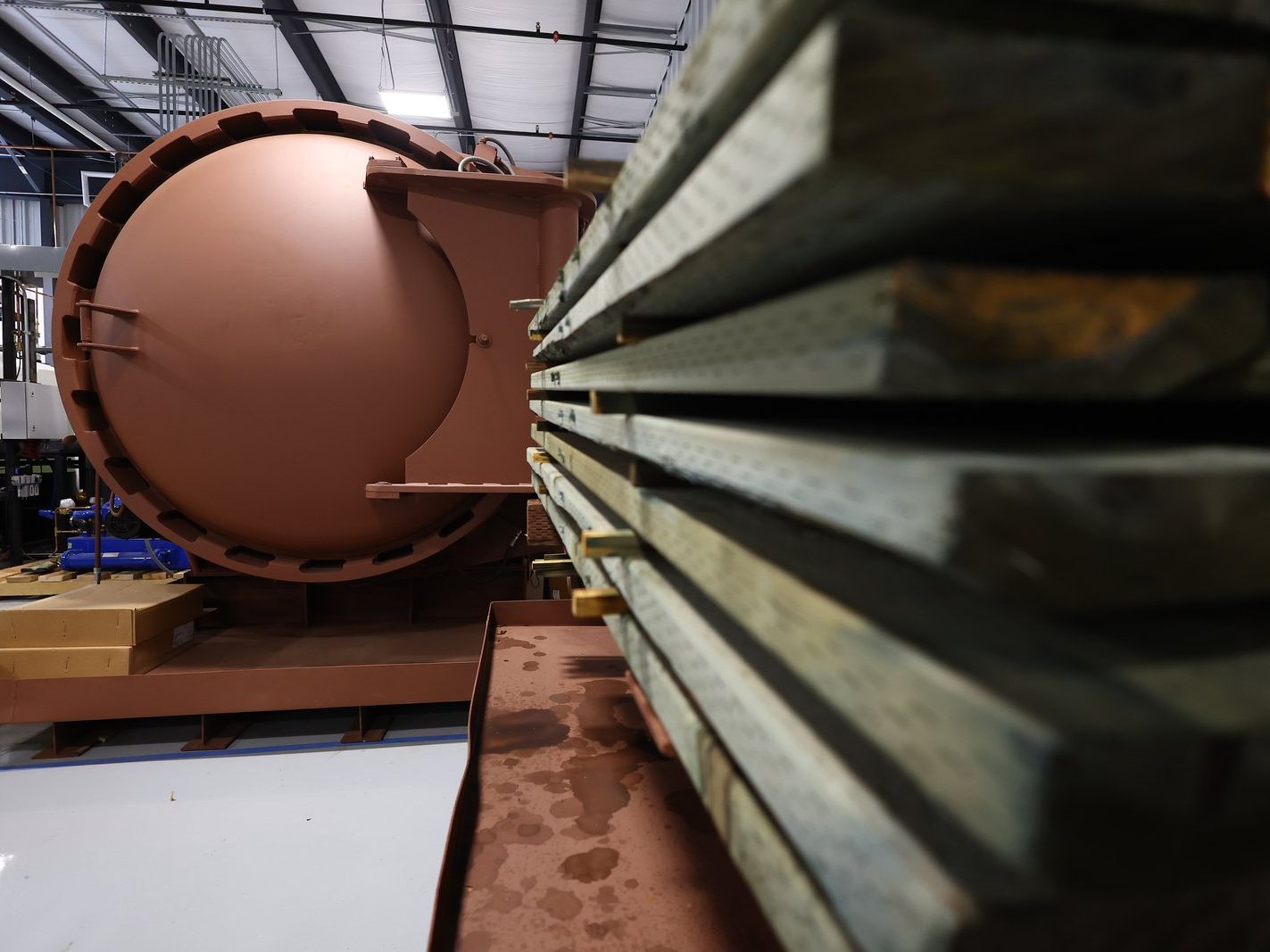 Copper-toned treatment cylinder on the plant floor