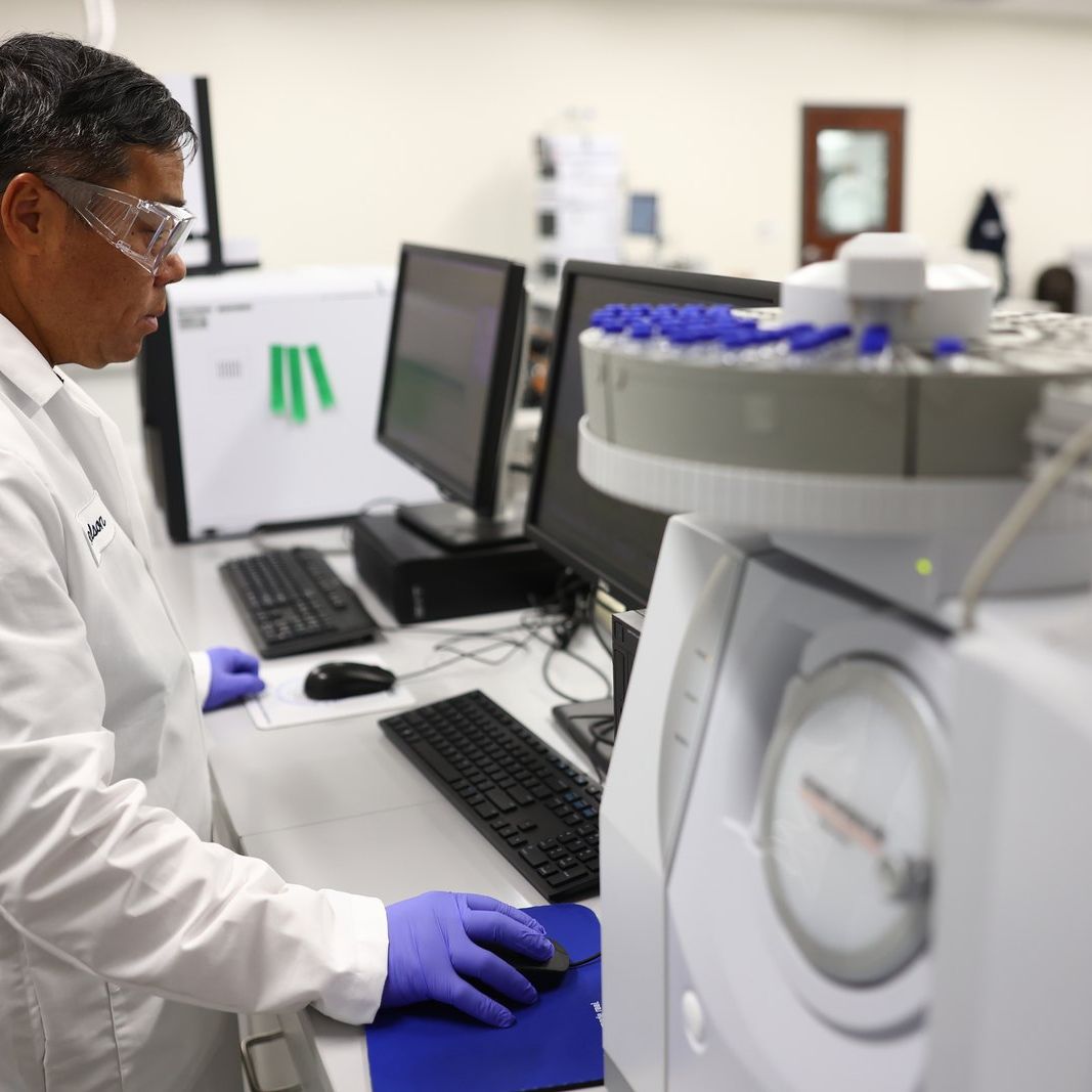 Analyst running an automated sampler