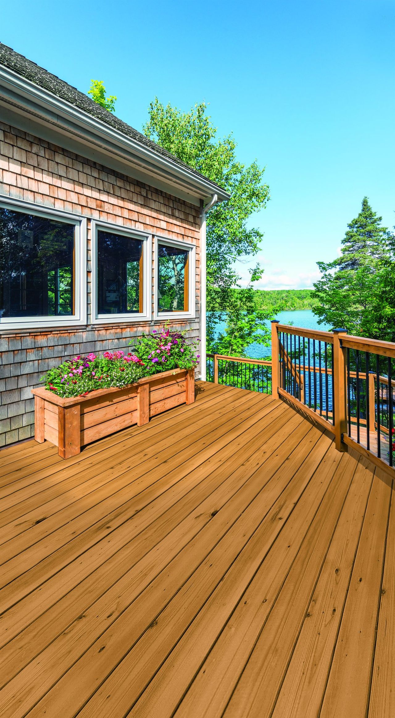 Treated-wood deck with planters overlooking the water