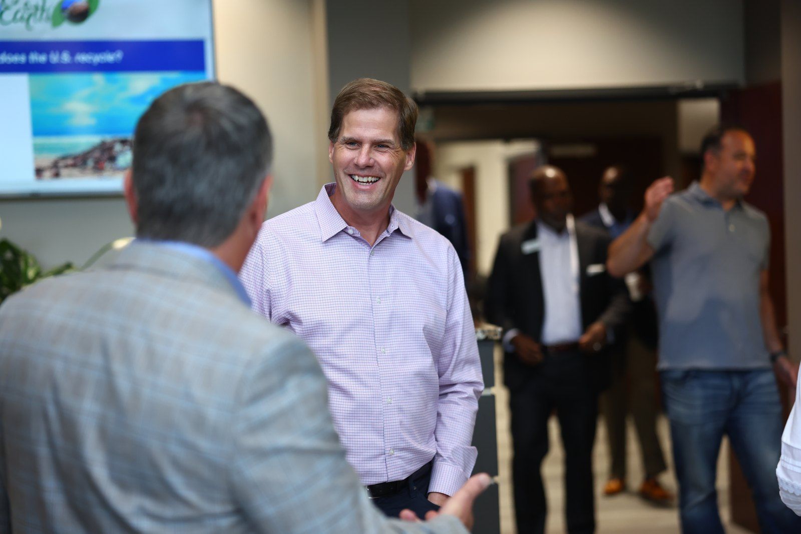 Koppers staff talking with a customer at a company event