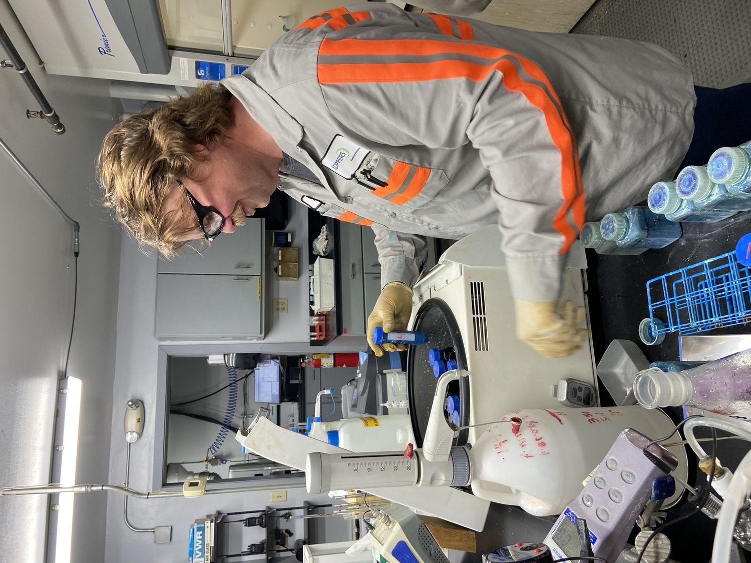 Koppers technician operating a laboratory centrifuge