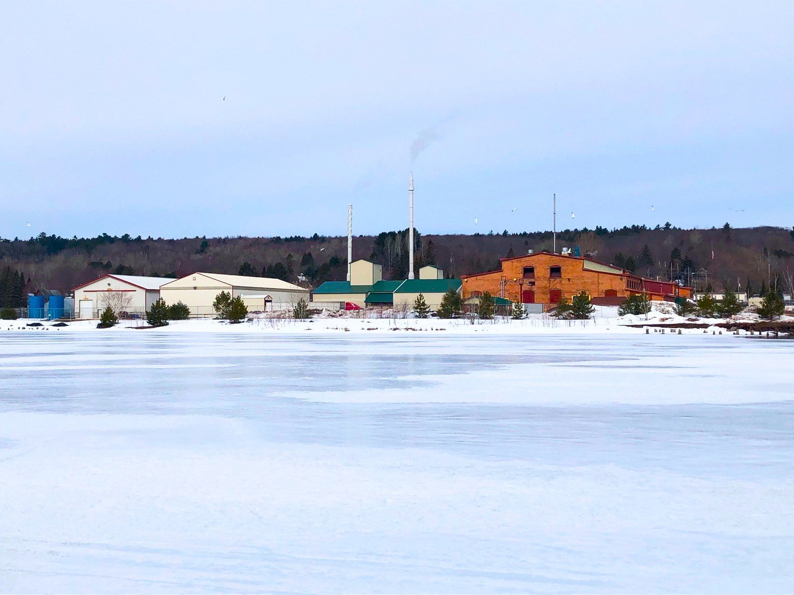 The Hubbell plant across the frozen lake in winter