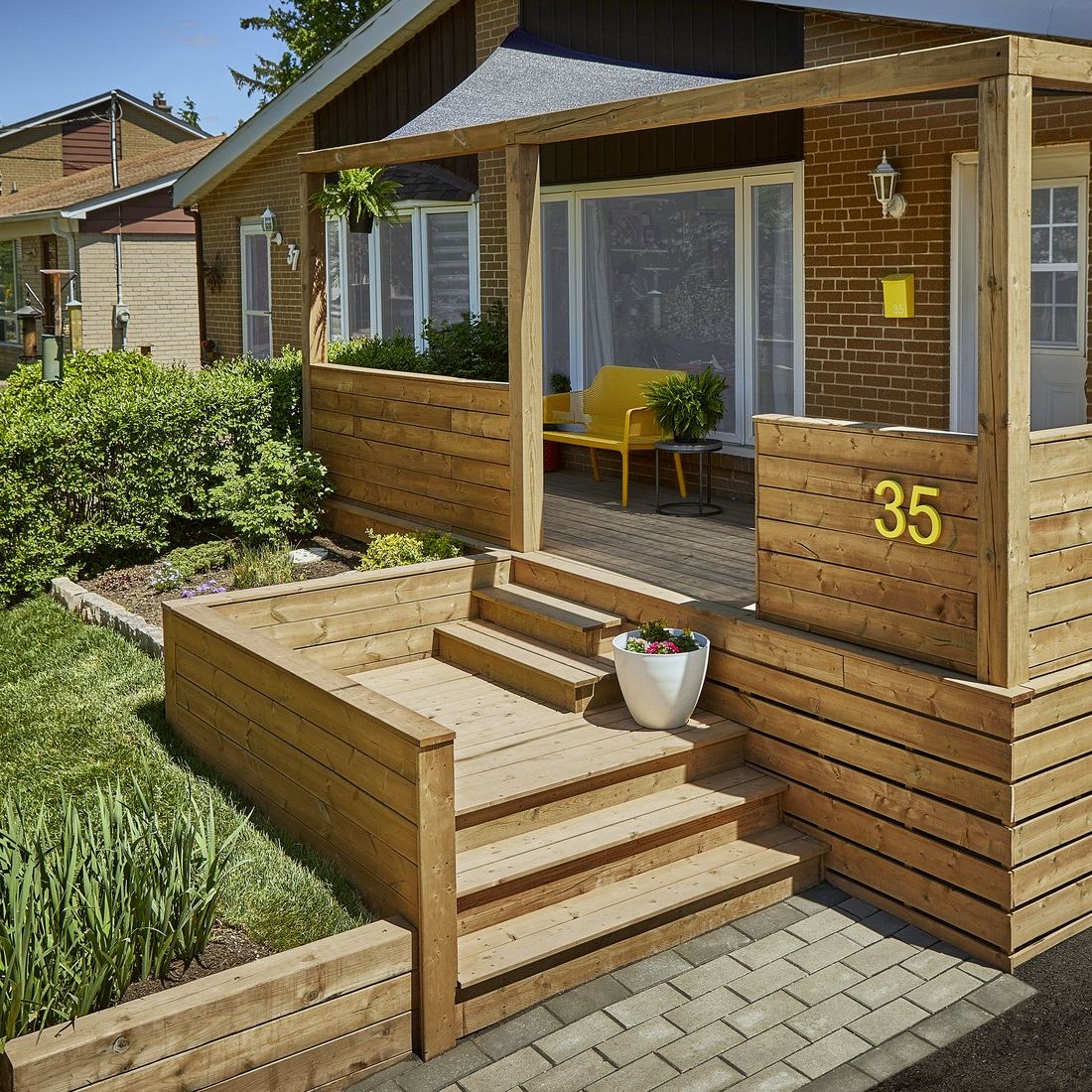 Treated porch steps on a brick house