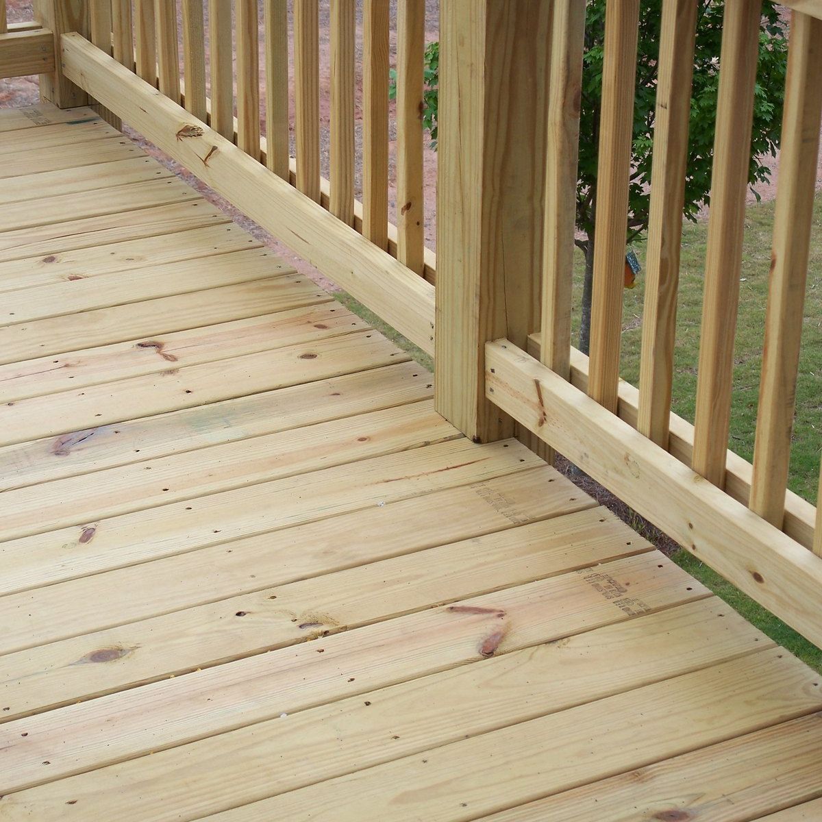 Pale treated deck boards and railing