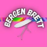 Et hvitt strykebrett står mot en knallrosa bakgrunn med en regnbuefarget stripe, og teksten «BERGEN BRETT» er buet over brettet i store hvite bokstaver.