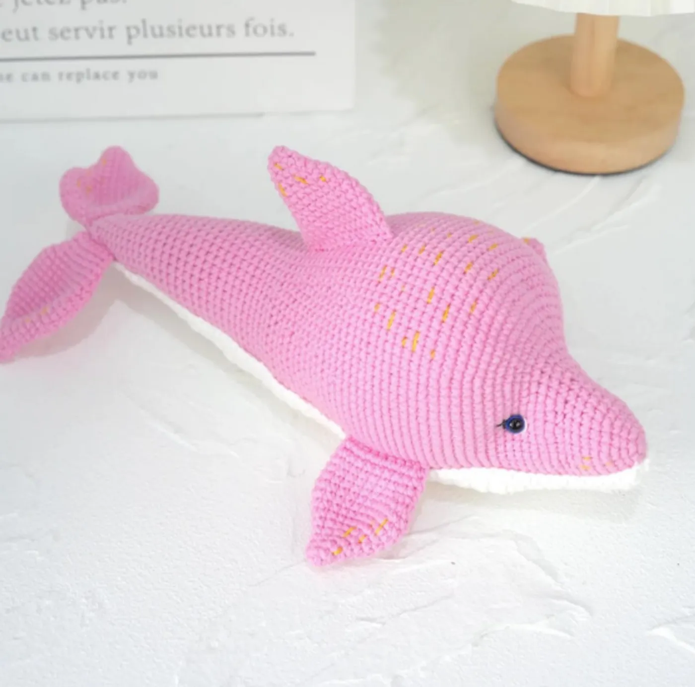 A beautiful pink and white handmade crochet dolphin amigurumi toy - Free Pattern