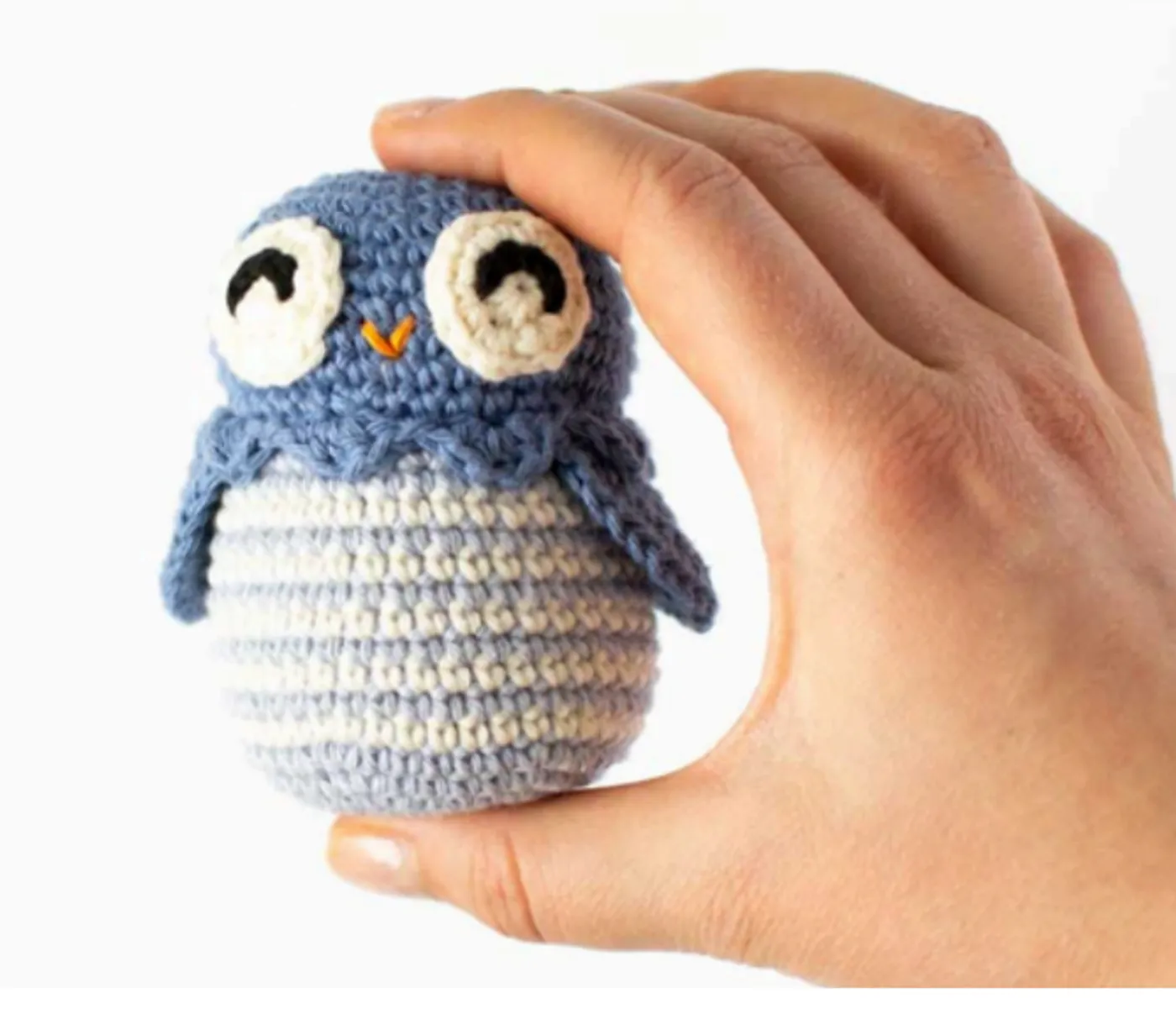 A small striped crochet owl named Bob with large white eyes and a decorative scalloped head edge, a Free pattern.