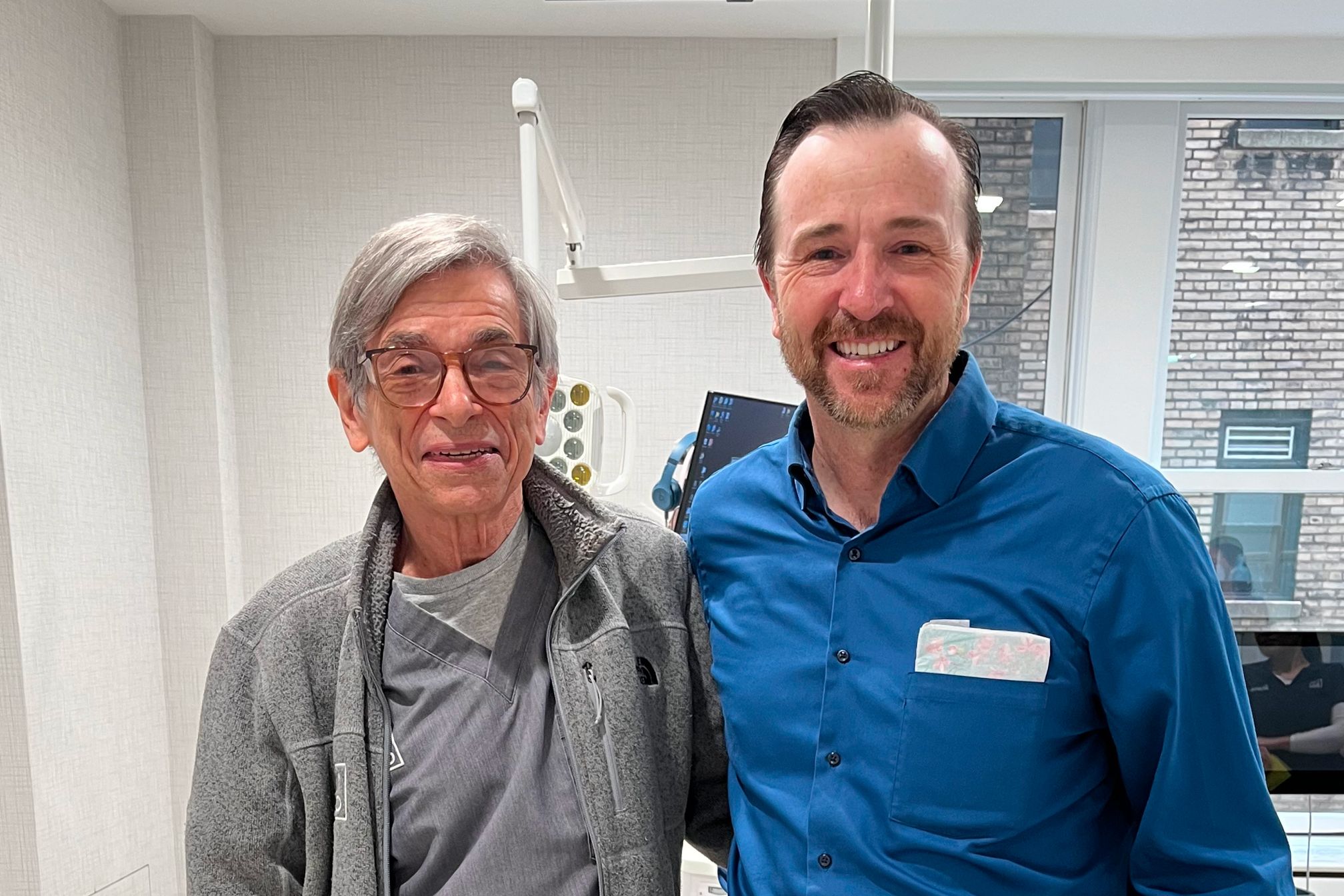 Dr. Marc Lemchen (left), creator of Virtual Intercom (VCom), and Dr. Drake (right), his partner leading development of the new version, pose together for a photo.
