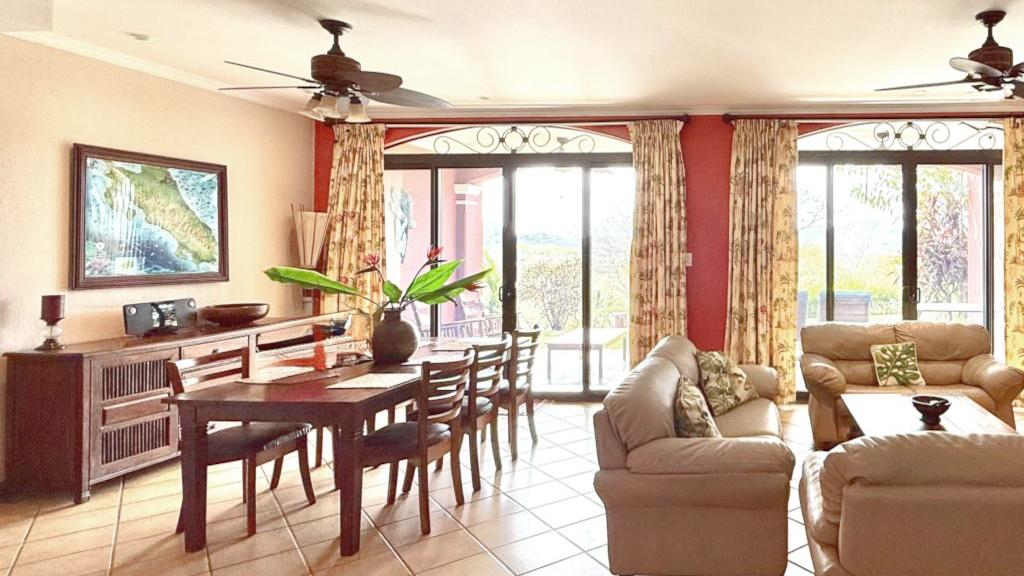 Living and dining area with ceiling fans – Bougainvillea 4101, Reserva Conchal, Guanacaste, Costa Rica