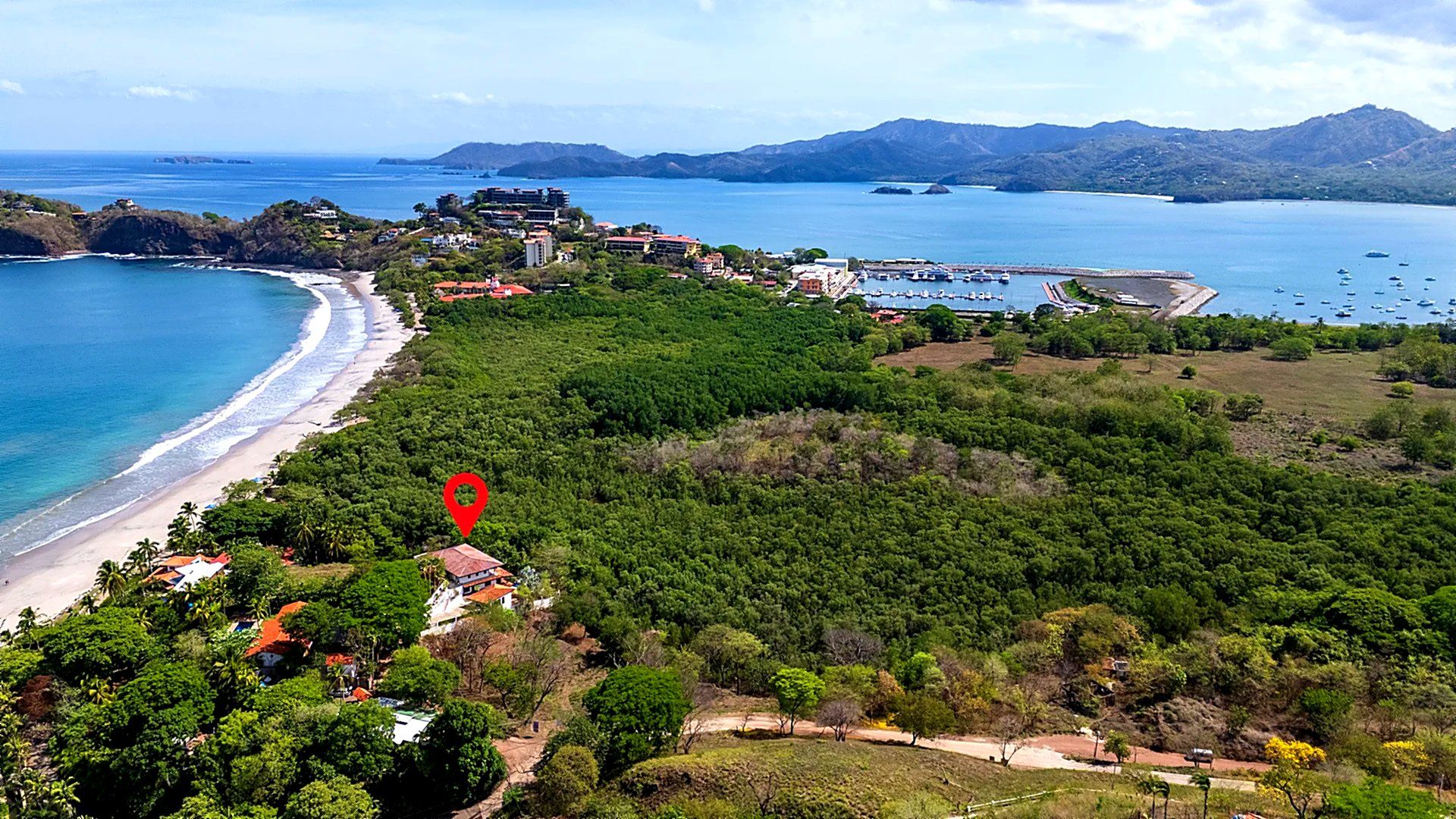 Casa Mimosa aerial of house along coastline