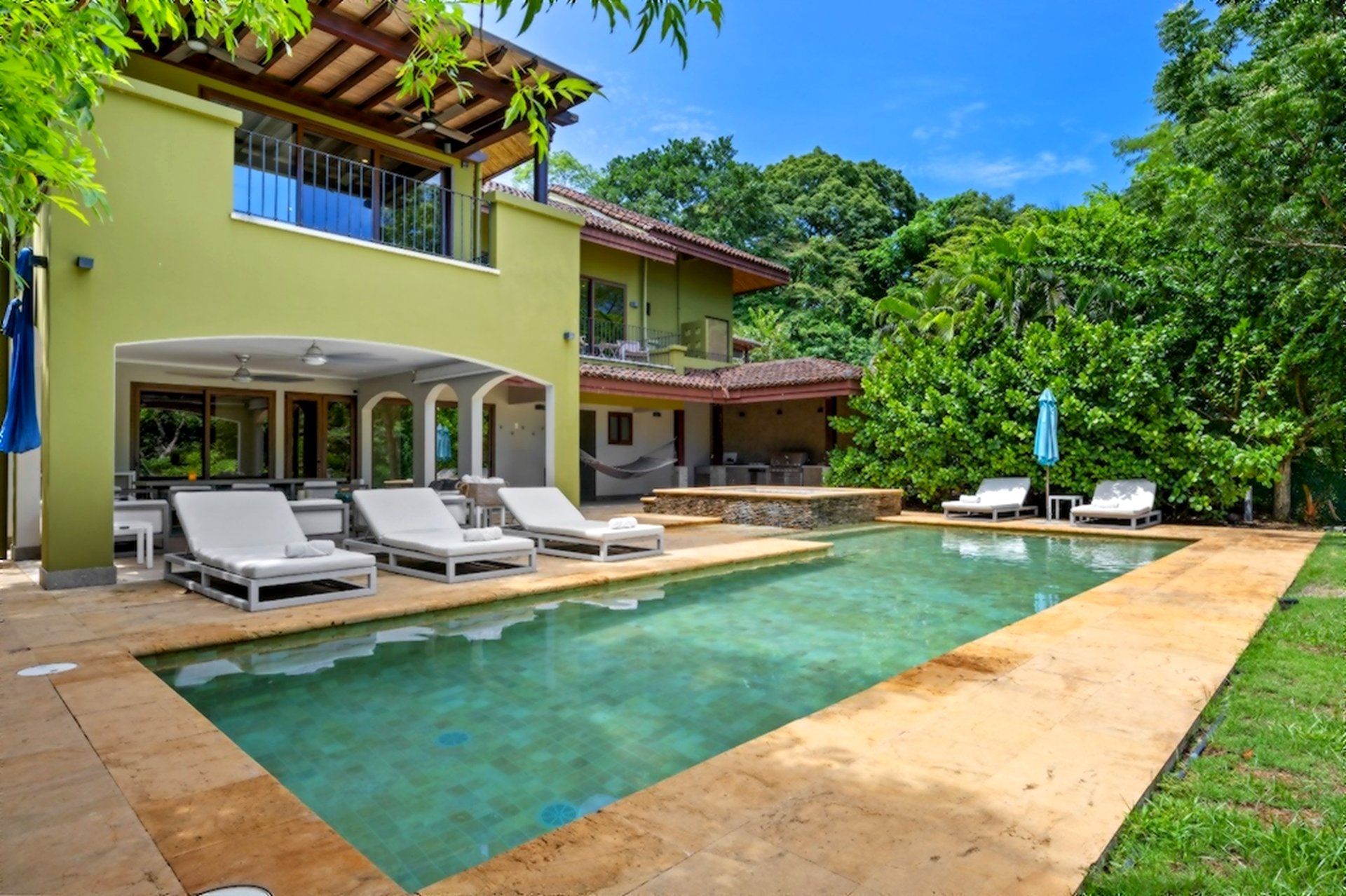 Villa Carao 11 exterior with pool, sun loungers and covered terrace