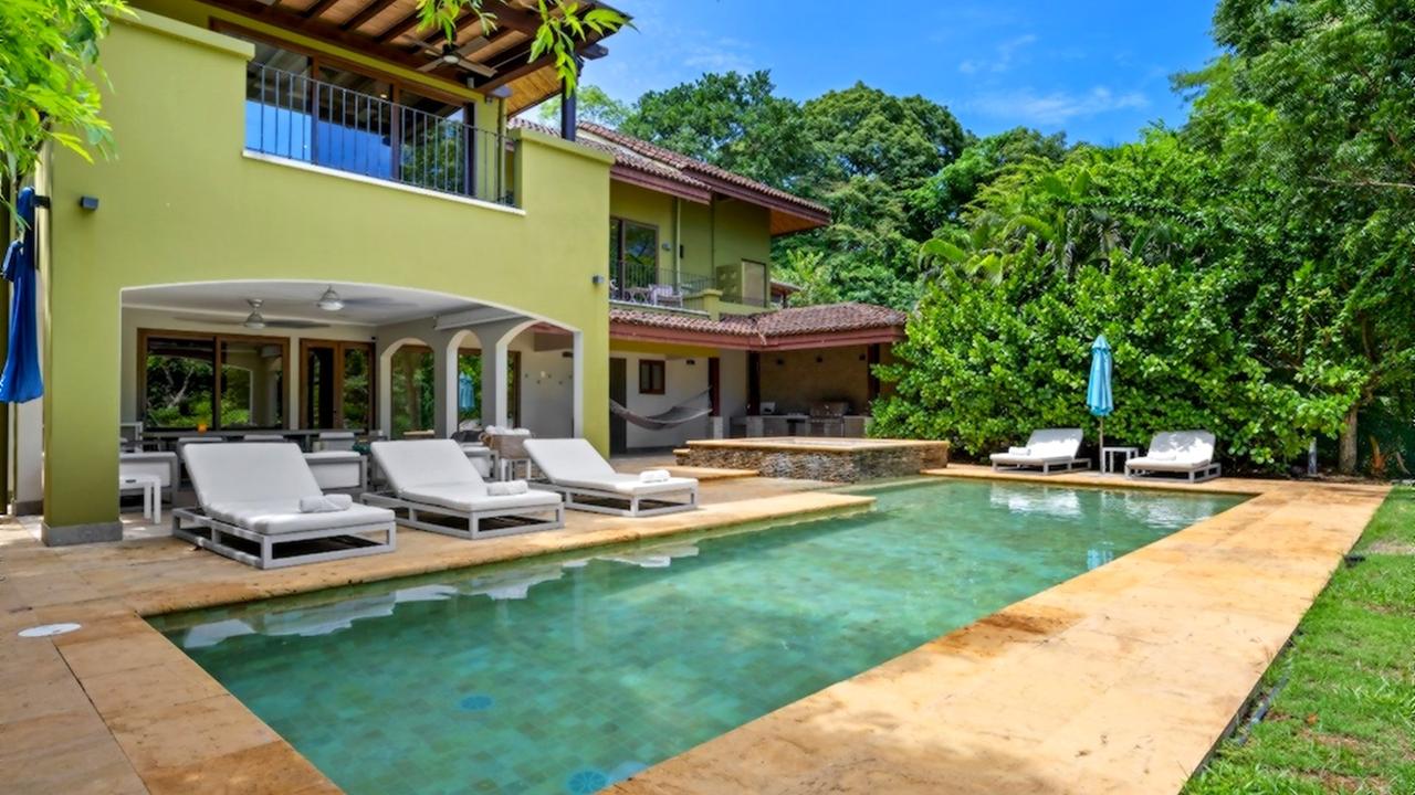 Villa Carao 11 exterior with pool, sun loungers and covered terrace
