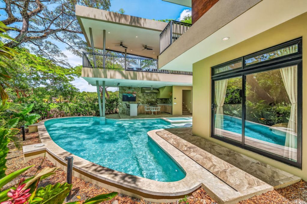 Curved pool and garden beside the home – Llama del Bosque #22, Casa 22, Reserva Conchal, Guanacaste, Costa Rica