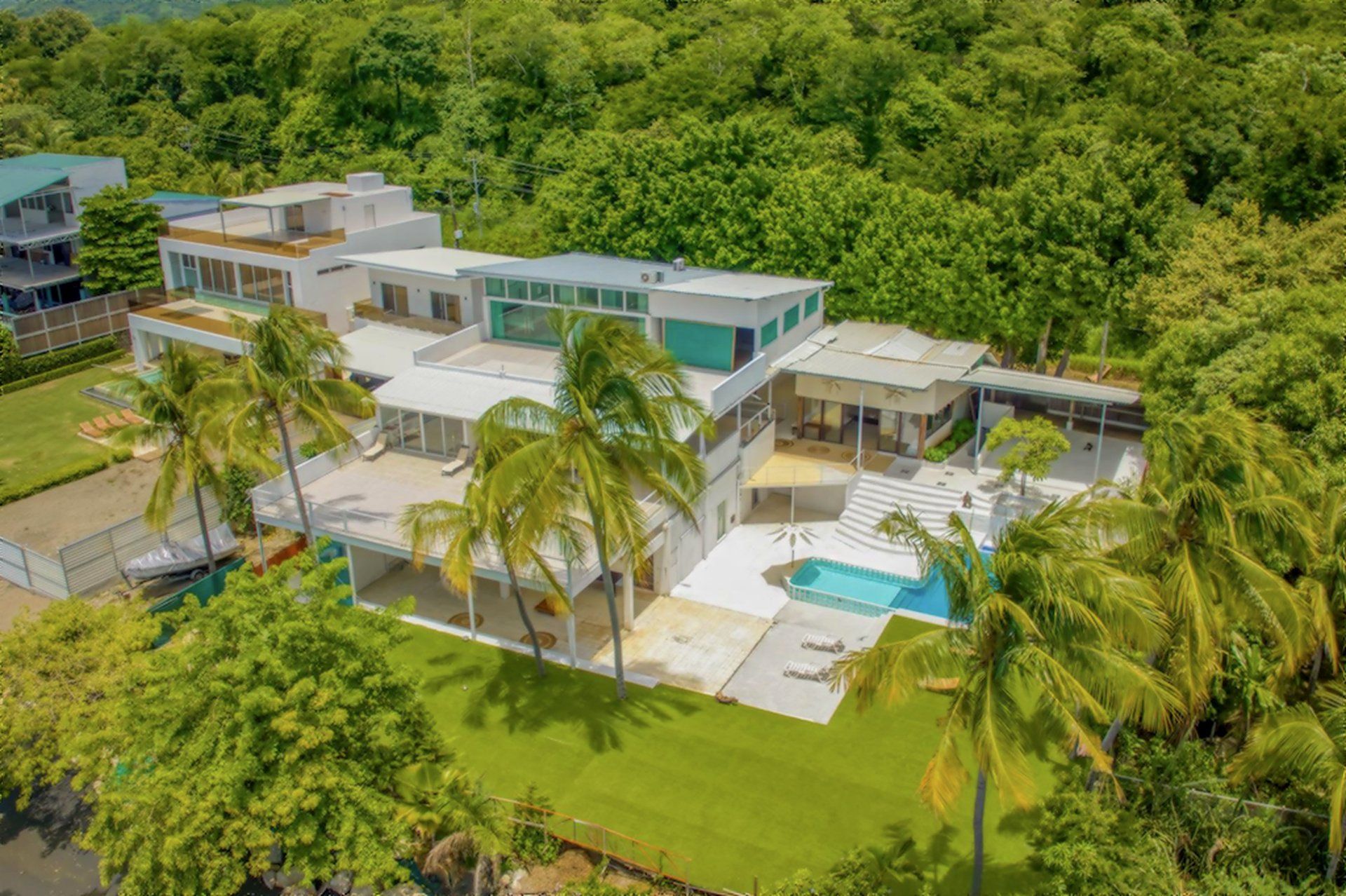 La Mansion aerial white mansion pool