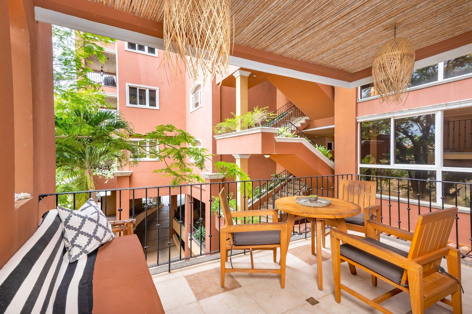 Private covered terrace with dining table and lounge seating – Naxos #6, Playa Langosta, Tamarindo, Guanacaste, Costa Rica