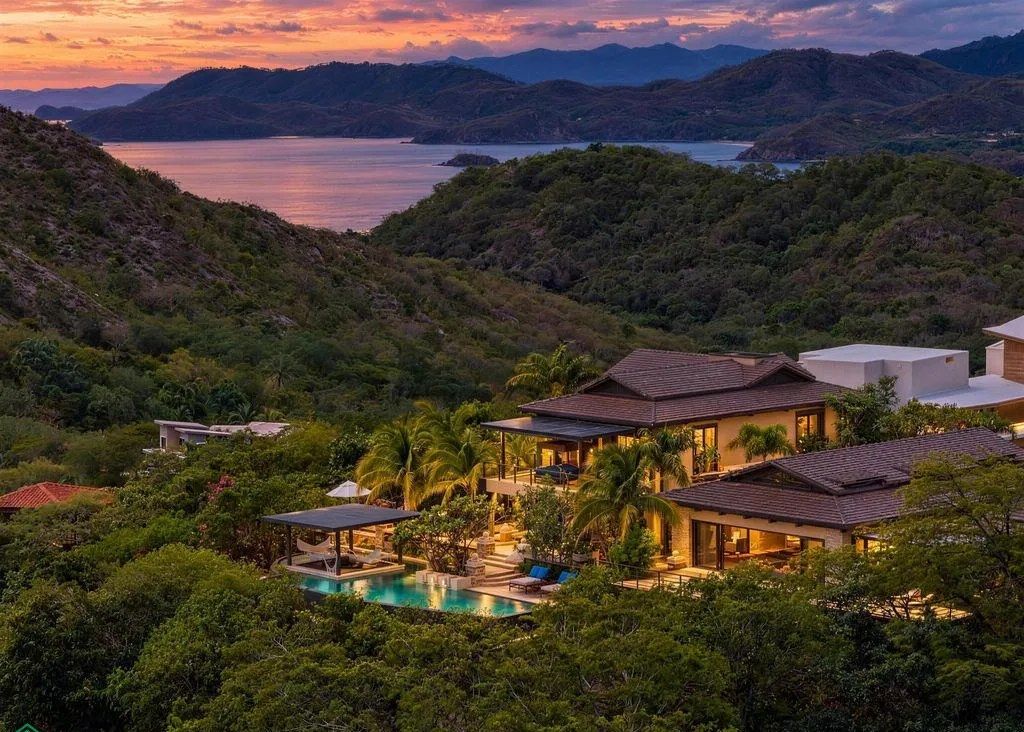 Aerial view of the villa and pool at dusk over the bay – Casa Shiva, Mar Vista, Playa Flamingo, Guanacaste, Costa Rica