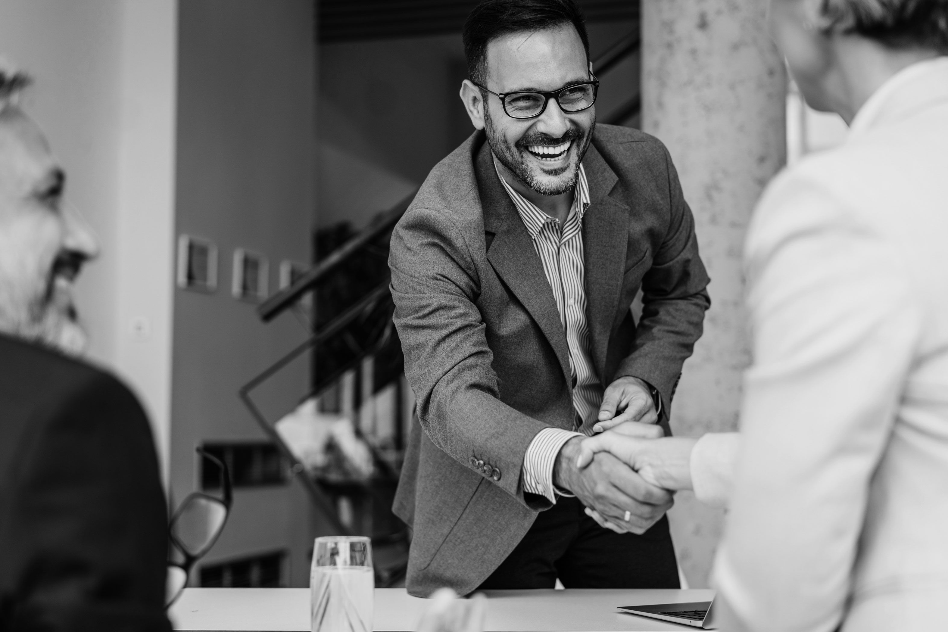 Man shaking hand and smiling