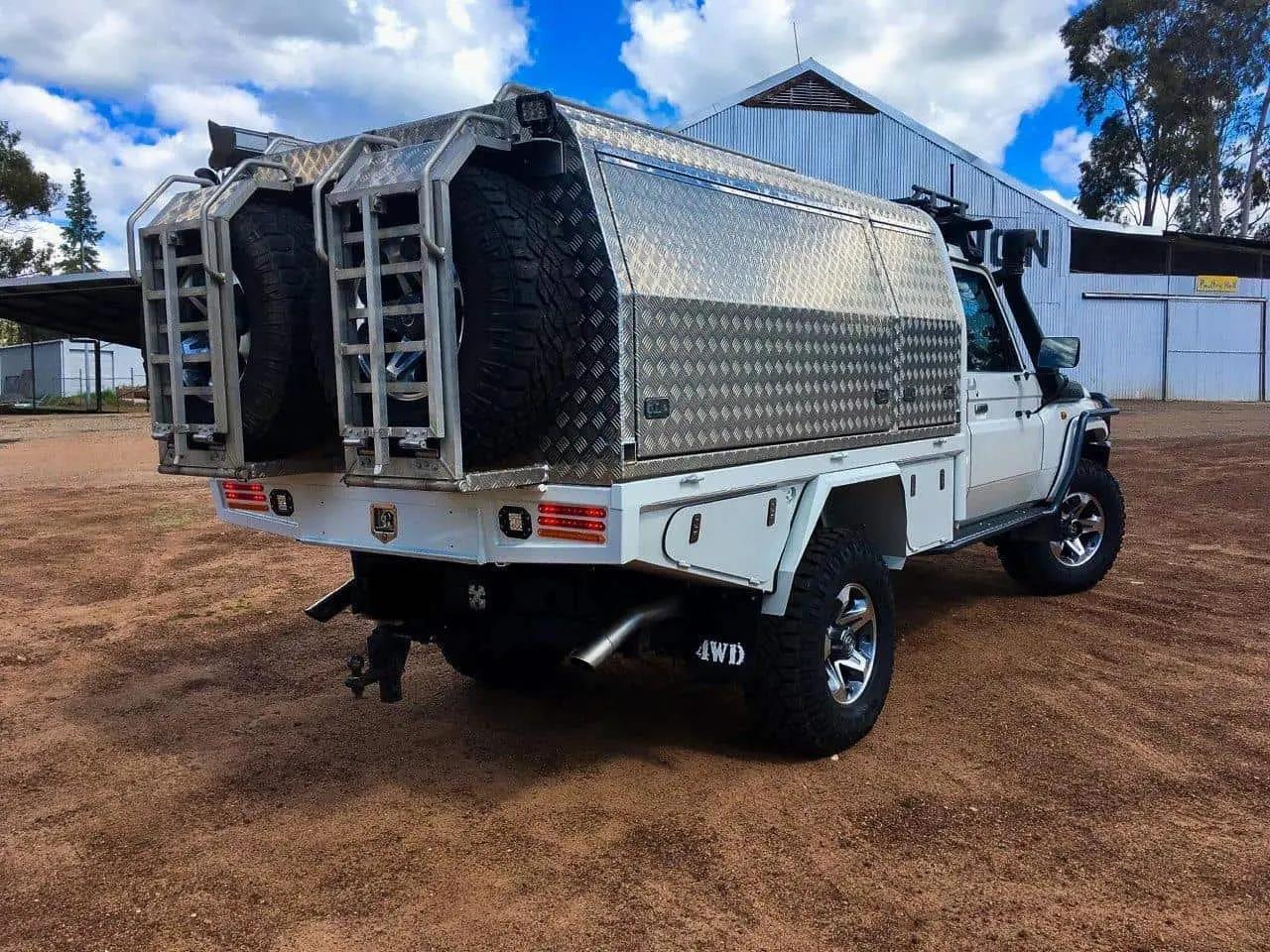 Aussie tradies' ute with tool boxes on the back.
