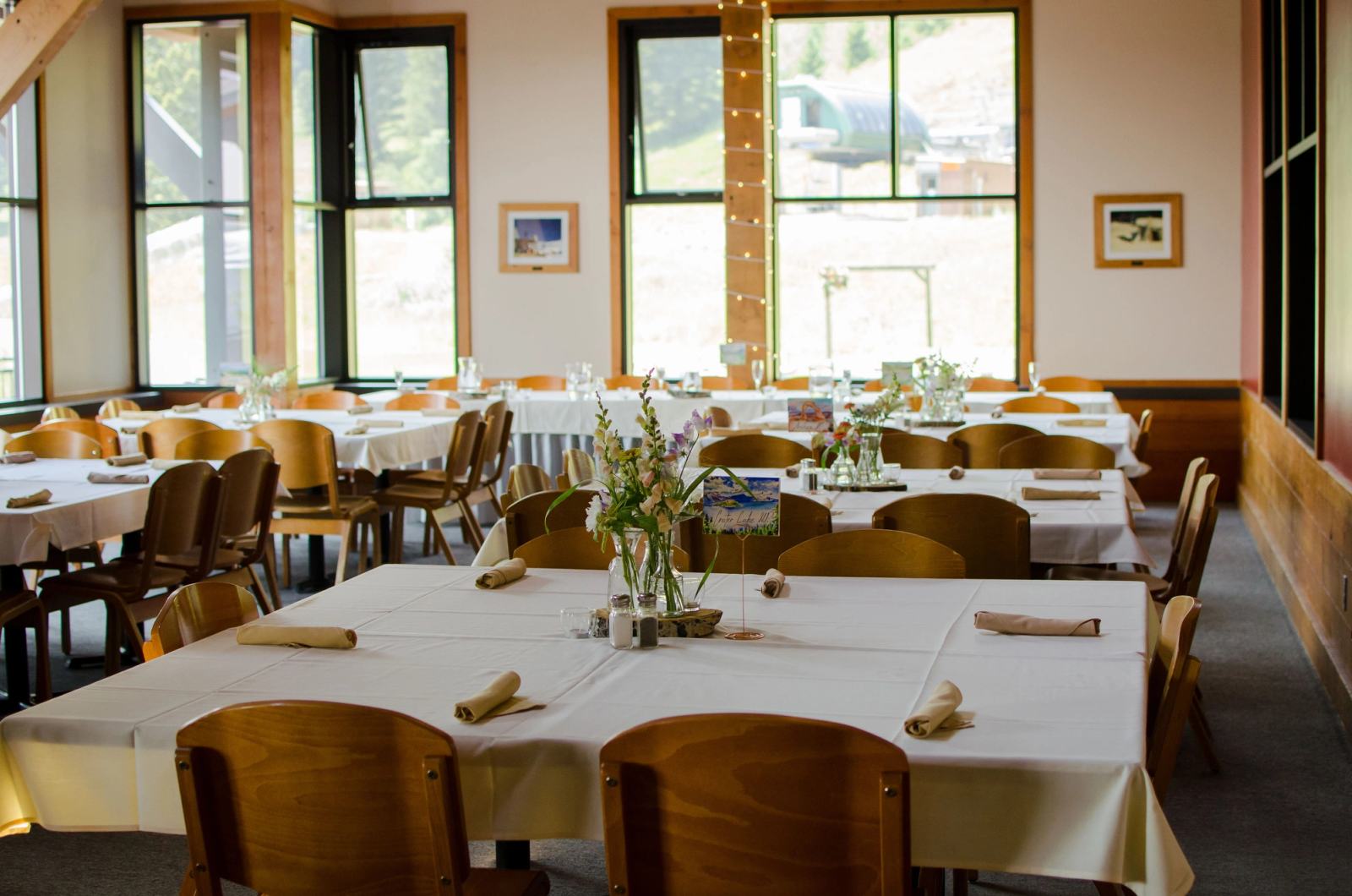 Dining room with tables set for service at Deer Park Chalet