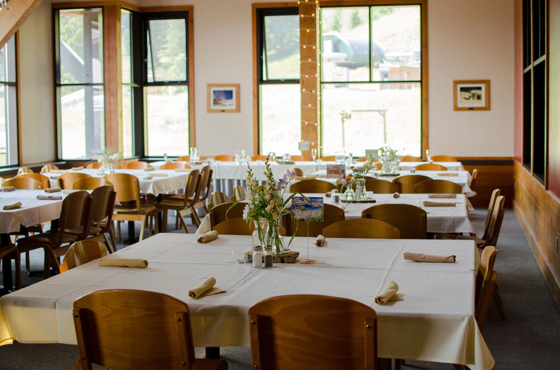 Dining room with tables set for service at Deer Park Chalet