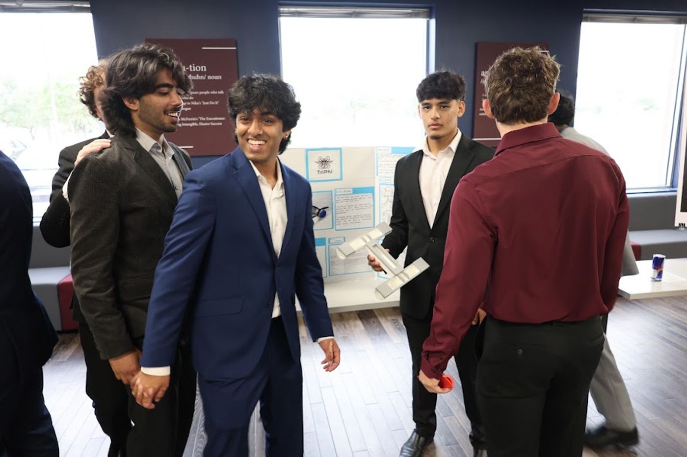 Team presenting with their poster and display