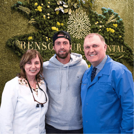 Tennis player Nikoloz Basilashvili posing with the team at Bensonhurst Dental Care