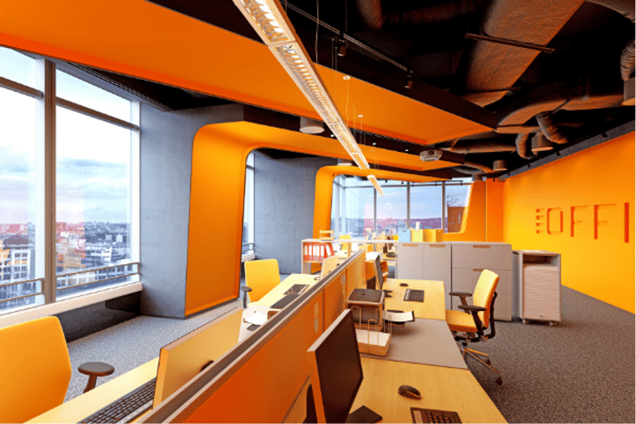 Modern open-plan office with bright orange walls and ceiling accents, orange desk chairs, rows of workstations, and large windows overlooking a city skyline.