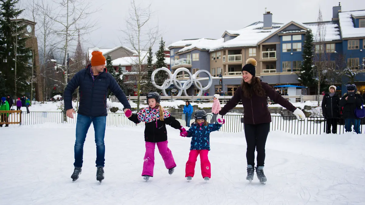 A family skating on an outdoor rink in Whistler