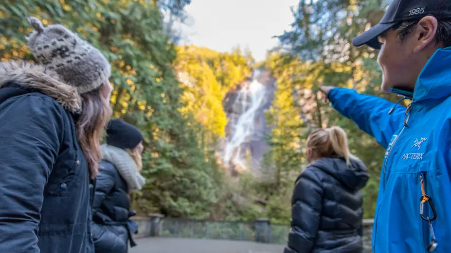 Tourists look at Shannon Falls in Squamish, BC