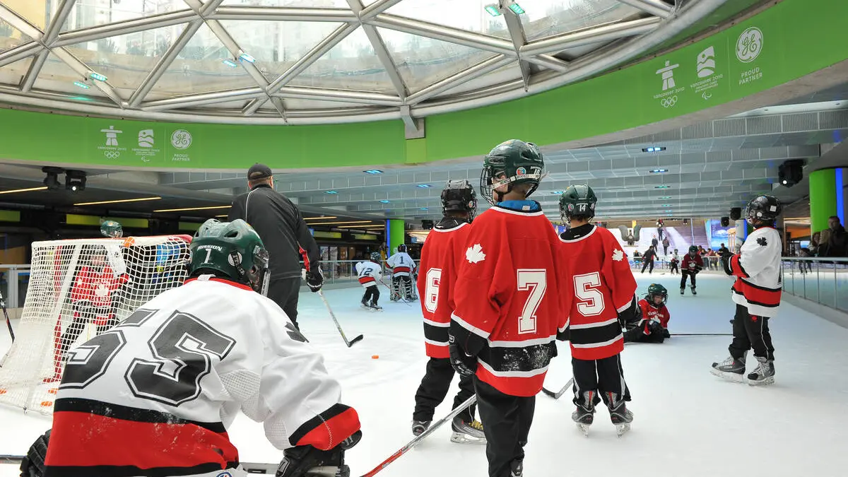 Children playing hockey at the Robson Square Ice Rink in Vancouver