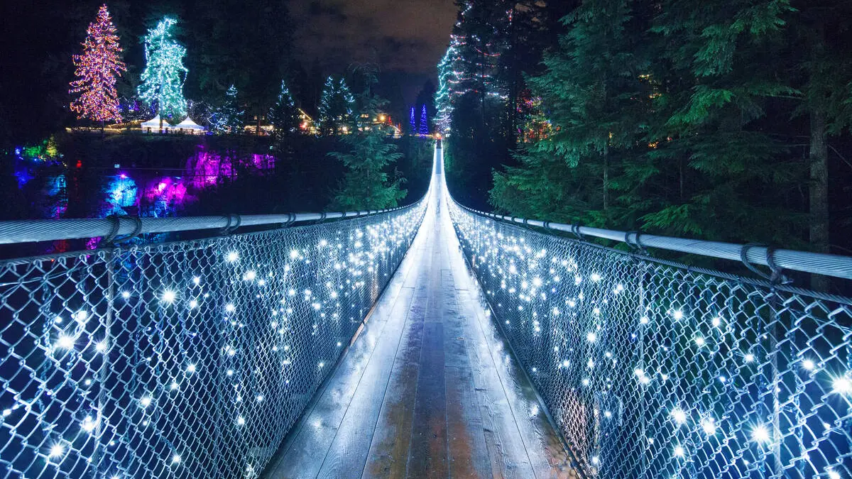 Lights decorate the suspension bridge and surrounding attractions at Capilano Suspension Bridge's Canyon Lights event