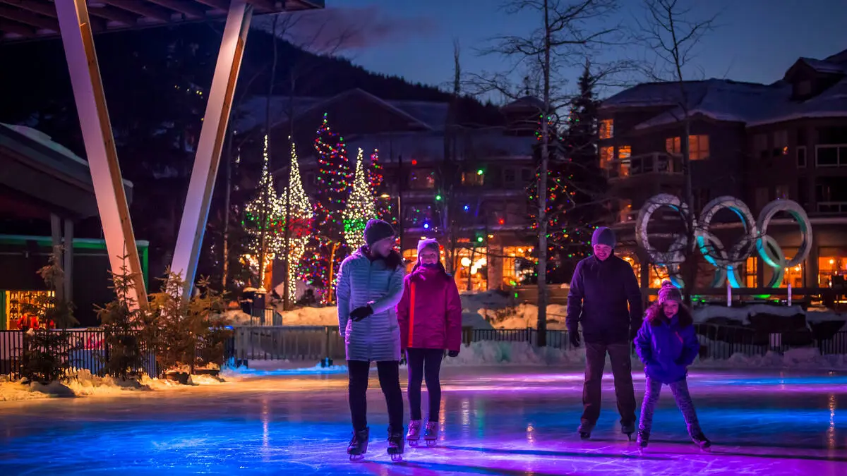 Ice skating at night at Whistler Olympic Plaza
