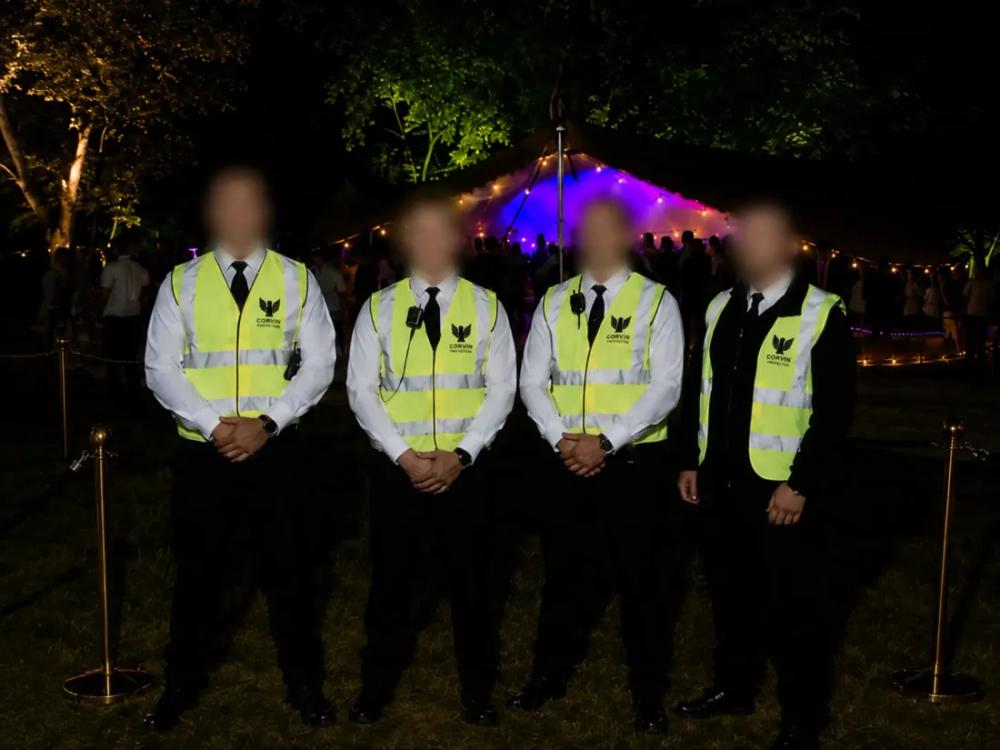 Corvin Protection team in branded hi-vis uniform at an event