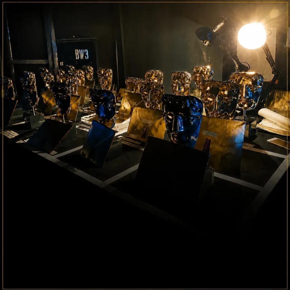 Gilded awards under protective lighting