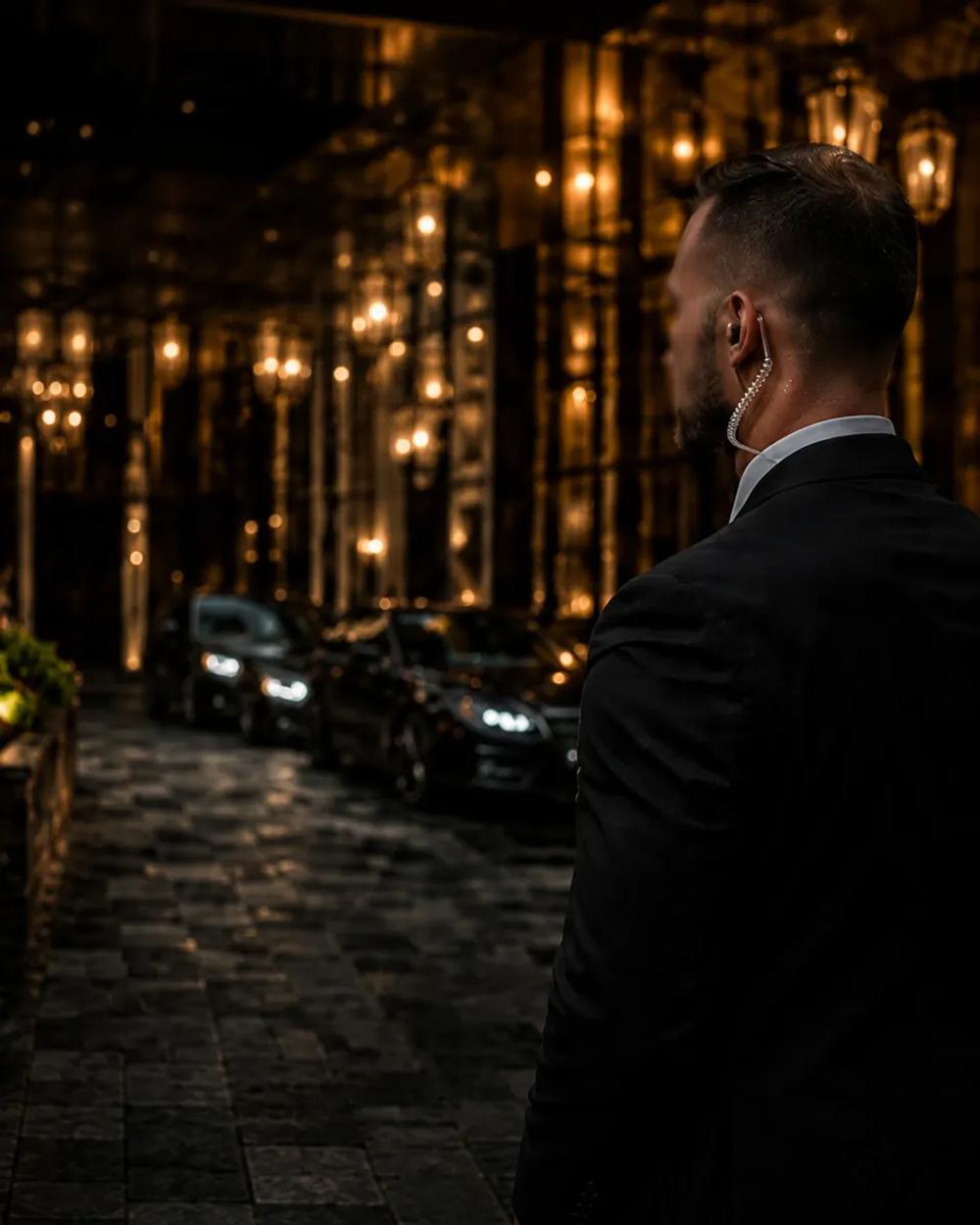 Suited security officer, warmly lit
