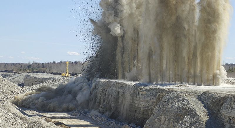 Blasting in a rock quarry