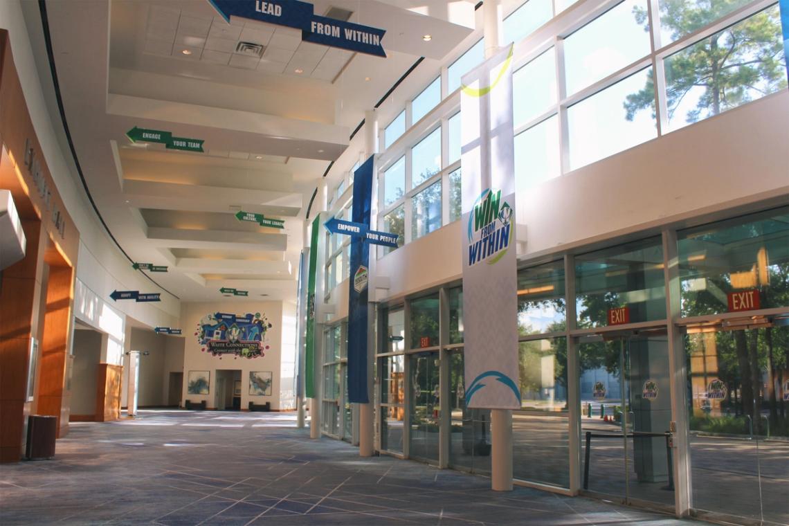 Win from Within wayfinding graphics along the interior walkway