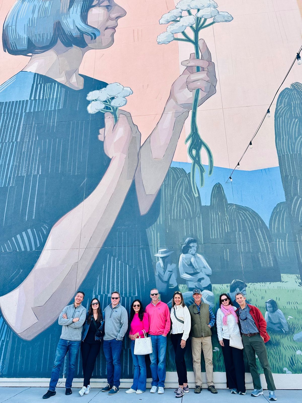 People in front on mural on Downtown Colorado Springs walking tour