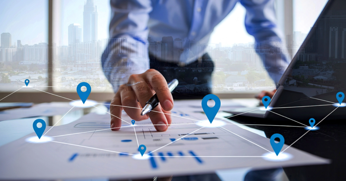 A person pointing at a digital map. 