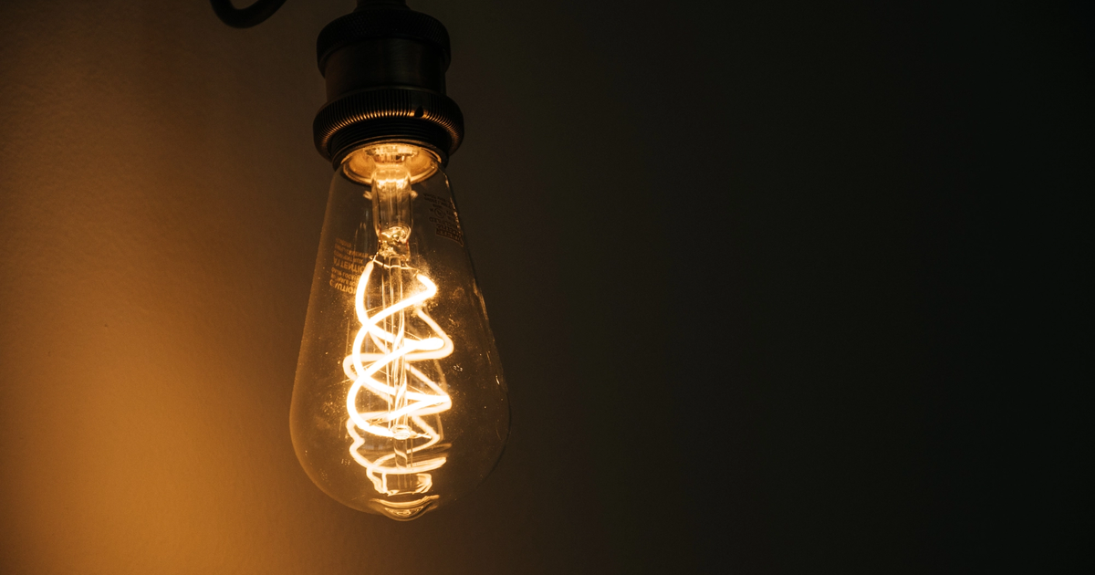 Glowing light bulb featured in "How to Cancel Automatic Energy Contract Renewals for Australian SMBs."