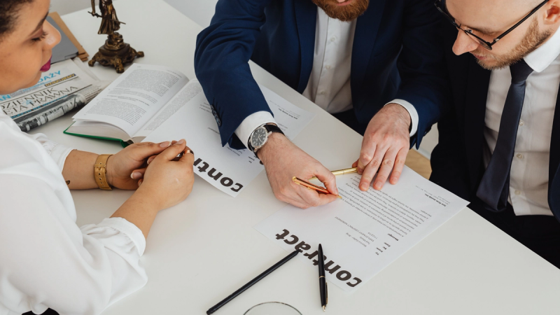 Business professionals reviewing their business energy contract. 