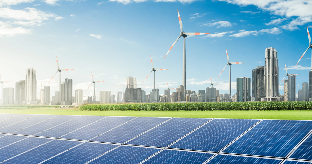Solar panels and wind turbines representing renewable energy infrastructure for Australian businesses.