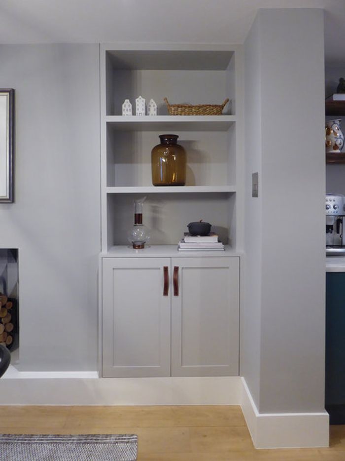 shelving and cupboards built into alcove