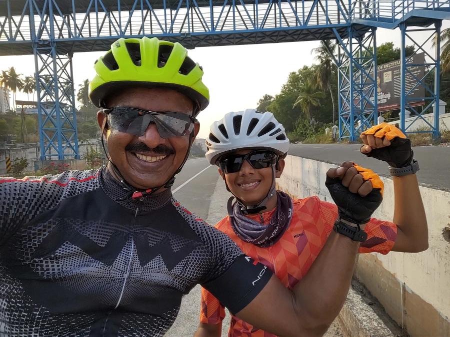 Young Juan and his father on a morning ride, both flexing for the camera