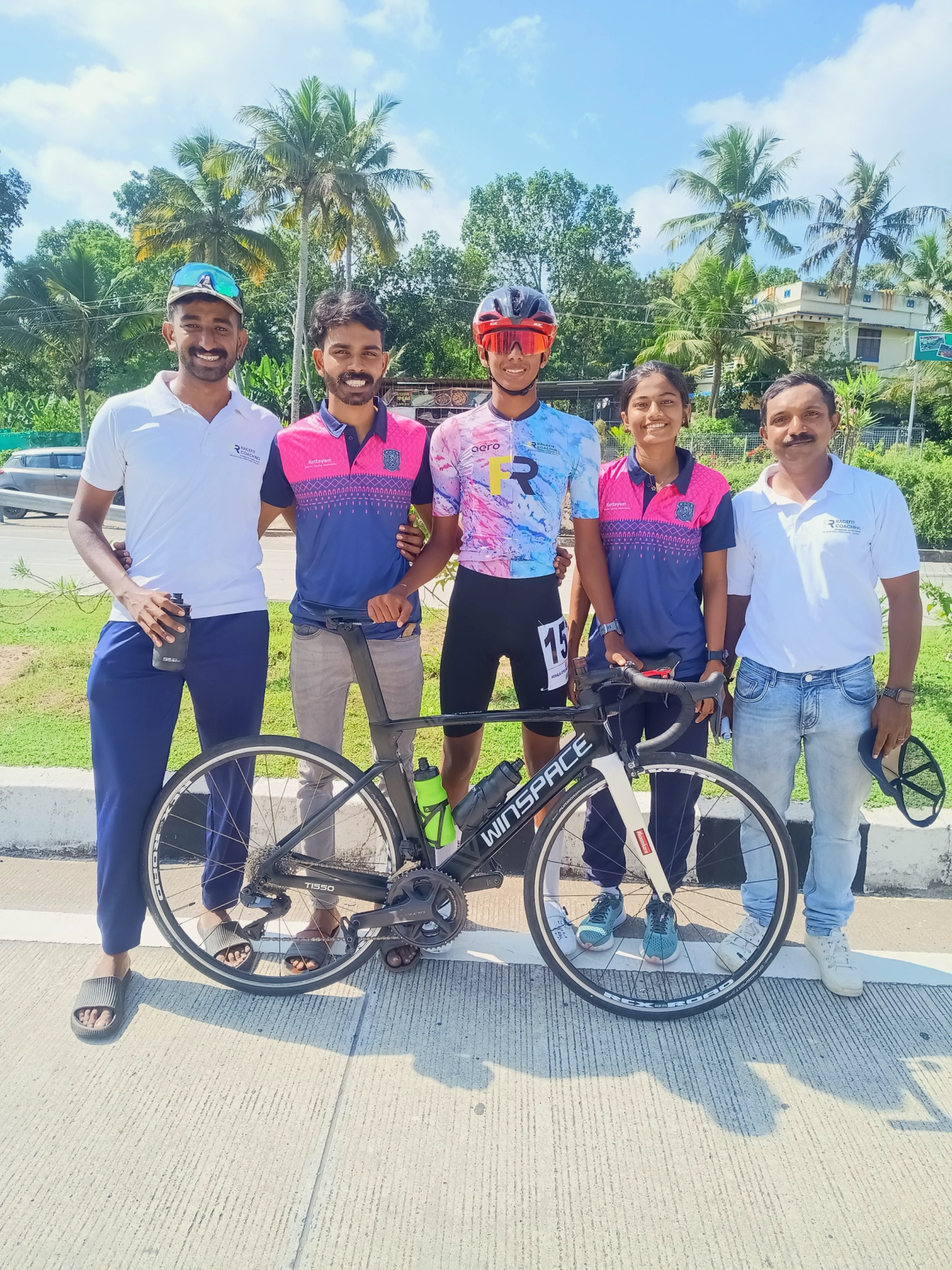 Juan Joy standing beside his road bicycle with Saiju DS, coach Renjith C, Devamitha & Sankar after his U16 mass-start silver medal.
