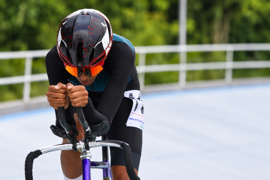 “Juan Joy racing on the velodrome, low over the handlebars of his track bike