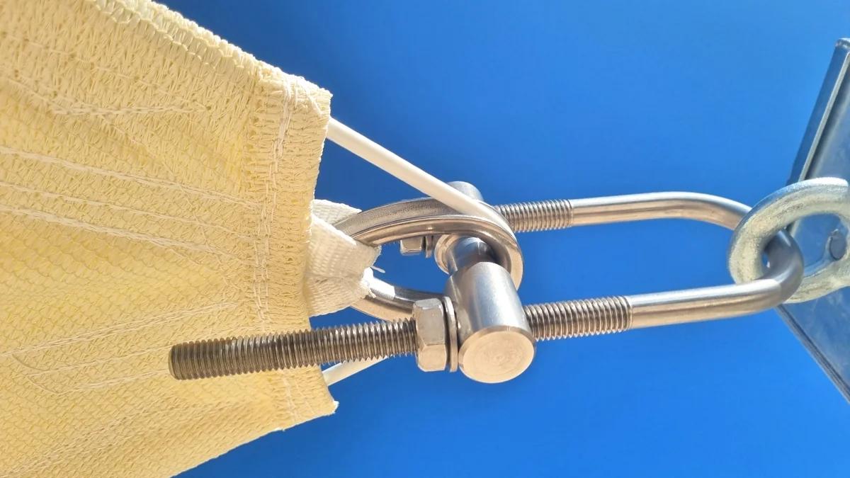 Detail of stainless steel tension hardware used for shade sail installation