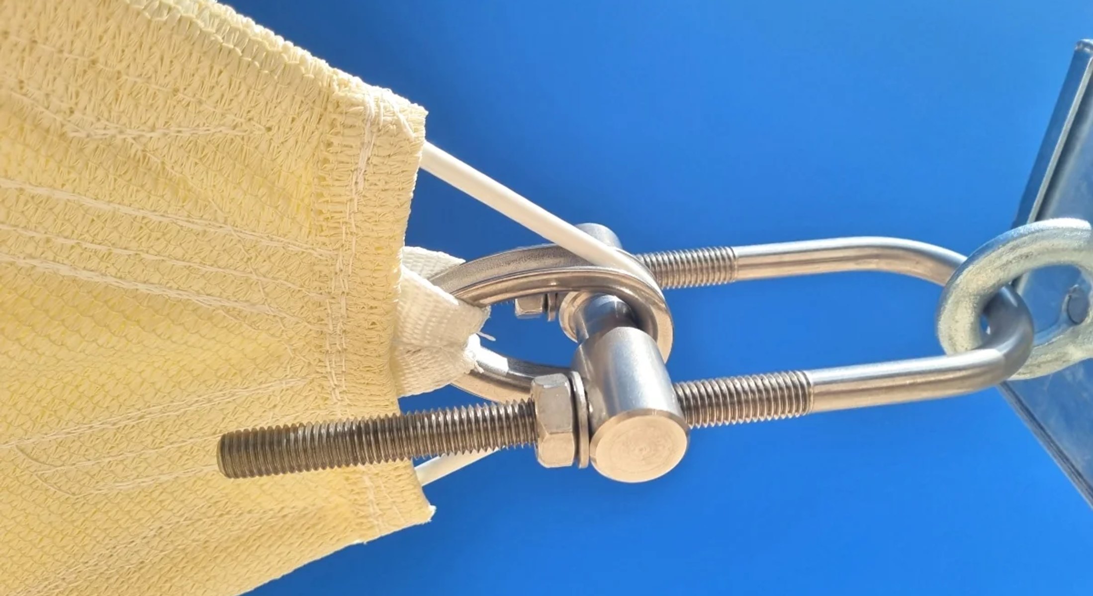 Detail of stainless steel tension hardware used for shade sail installation