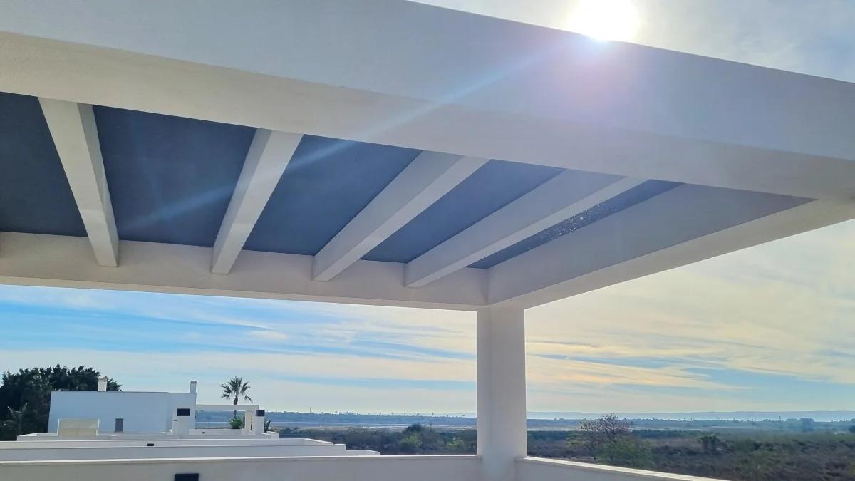 Fixed shade panels in a pergola roof on a rooftop terrace