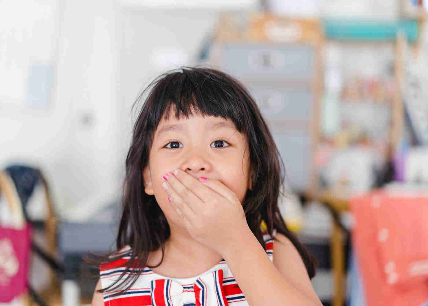 Cute little girl covers mouth what should you do about broken tooth